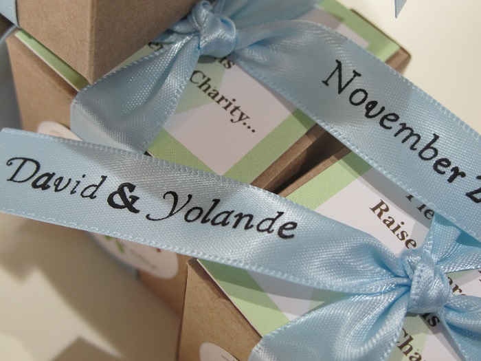 Canadian Cancer Society -close up of printed ribbons for David & Yolande's chocolate favors in kraft boxes.