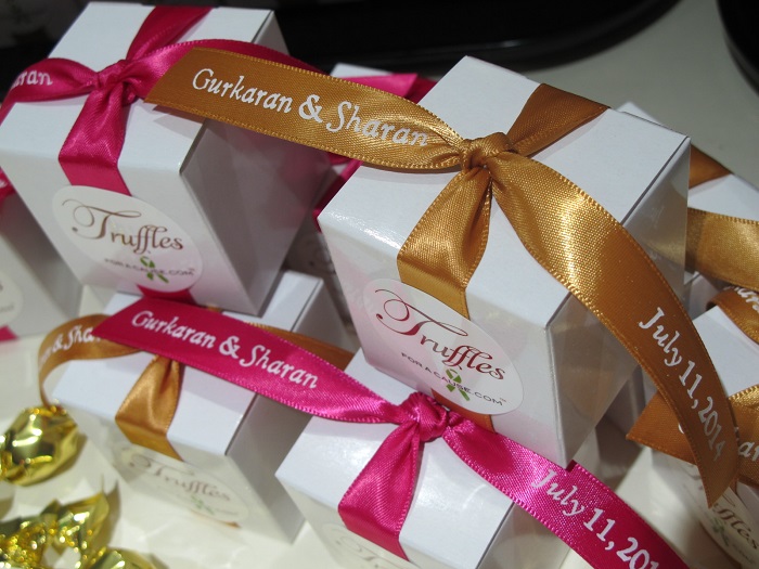 Overhead close-up photo of printed favor ribbons for Gurkaran & Sharan - chocolate wedding favors for American Brain Tumor Society & American Cancer Soceity