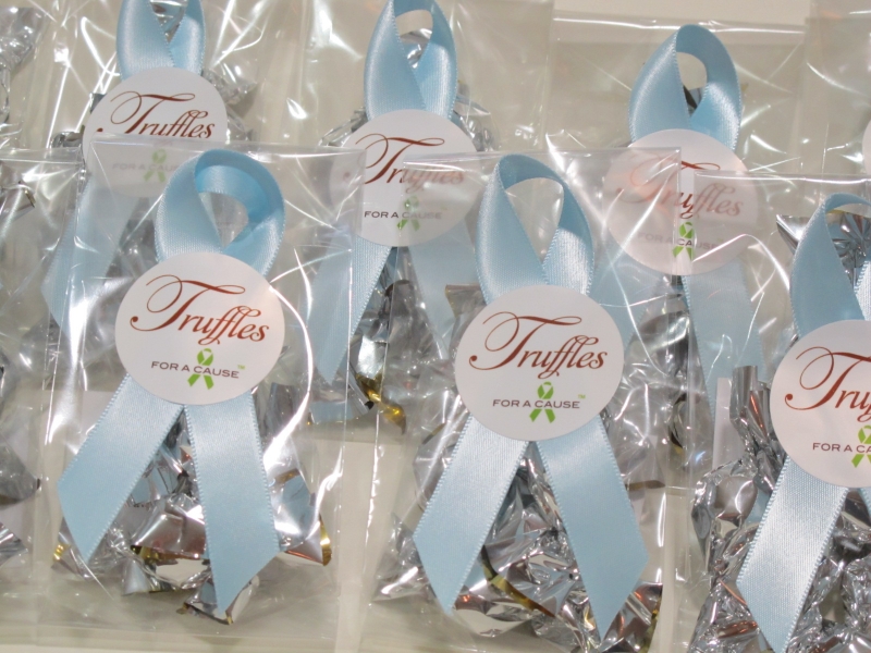 Lt. Blue ribbons on Mini favors with silver chocolate mini truffles inside.