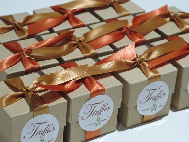 Gold &  Burnt Sienna ribbons on kraft favor boxes with chocolate mini truffles inside ready for shippig.